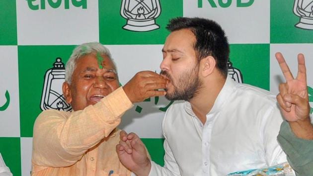 Rashtriya Janata Dal (RJD) leader Tejashwi Yadav is offered sweets by RJD state president Ramchandra Purbey in celebration of the party's Jokihat assembly by-election seat victory in Patna. Yadav said that the defeat of JD(U)’s candidate was a total rejection of the ‘illegally formed NDA government’. (PTI) Rashtriya Janata Dal (RJD) leader Tejashwi Yadav is offered sweets by RJD state president Ramchandra Purbey in celebration of the party's Jokihat assembly by-election seat victory in Patna. Yadav said that the defeat of JD(U)’s candidate was a total rejection of the ‘illegally formed NDA government’. (PTI)