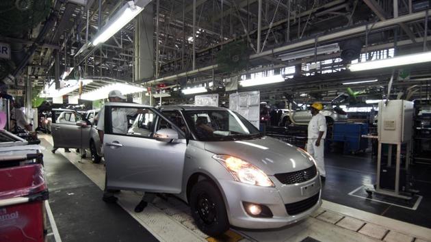 A finished car rolls off the assembly line after a complete check at the Maruti Suzuki Plant. From its garage built prototypes to annual productions of around 1.5 million vehicles, Maruti has for a generation defined the automobile in India. Similarly, Gurugram despite its stumbles is the country’s answer to building a modern hub of global manufacturing, industry and retail. (Ramesh Pathania / Mint Archive)