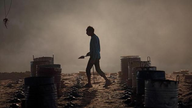 A worker feeds coal into an oven. “We have to clean the brick industry from not just an environmental perspective but also a human one,” said Better Brick Nepal’s head Homraj Acharya. And on that issue, he added, the Nepal earthquake has not yet cracked the factory owners’ hardline opposition to change. (Gopen Rai / AFP) 