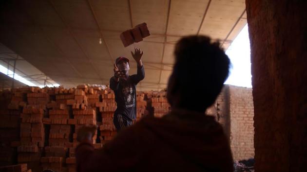 The Brick Kiln Initiative, launched by the International Centre for Integrated Mountain Development (ICIMOD), found a way to redesign the ovens and stack bricks differently. By stacking bricks inside kilns in a zig-zag pattern, heat snakes through the gaps more efficiently, ensuring coal is completely burned and less soot is produced. Emissions are cut by 60% and for kiln owners, coal consumption is nearly halved. (Gopen Rai / AFP) 