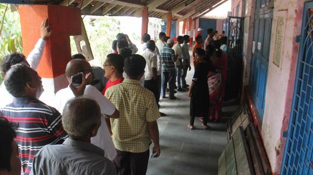 Voters stand in queue outside a polling booth during elections in Palghar on Monday. (Hindustan Times) Voters stand in queue outside a polling booth during elections in Palghar on Monday. (Hindustan Times)