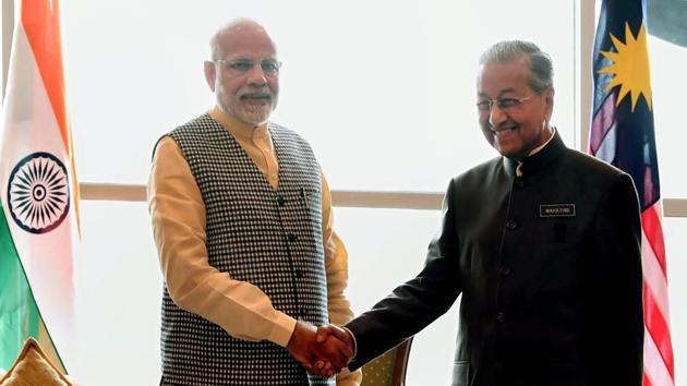Prime Minister Narendra Modi greets his Malaysian counterpart Mahathir Bin Mohamad in Kuala Lumpur, Malaysia. Modi’s arrival in Malaysia marks the second phase of his five-day tour to Indonesia, Malaysia and Singapore. (PTI) Prime Minister Narendra Modi greets his Malaysian counterpart Mahathir Bin Mohamad in Kuala Lumpur, Malaysia. Modi’s arrival in Malaysia marks the second phase of his five-day tour to Indonesia, Malaysia and Singapore. (PTI)