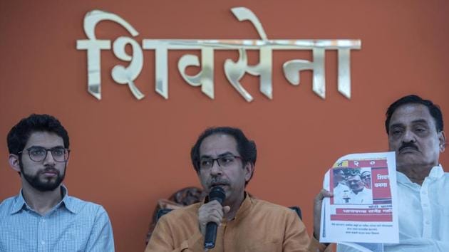 Shiv sSena chief Uddhav Thackeray with Yuva Sena chief Aditya Thackeray address a press conference at Sena Bhavan in Mumbai on Thursday.(Satish Bate/HT Photo)