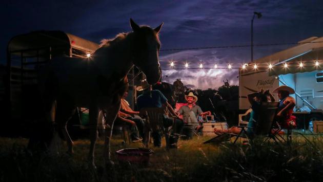 Lightning fills the sky as cowboys from the Rio Grande Valley set camp after arriving for Memorial Day weekend at Bandera in Texas, U.S on May 25, 2018. (Adrees Latif / REUTERS) Lightning fills the sky as cowboys from the Rio Grande Valley set camp after arriving for Memorial Day weekend at Bandera in Texas, U.S on May 25, 2018. (Adrees Latif / REUTERS)