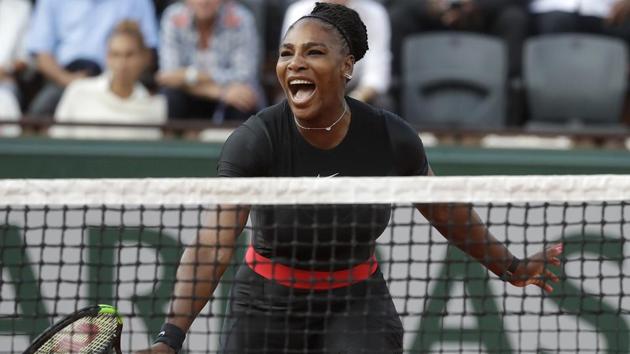 Serena Williams celebrates after her victory over Ashleigh Barty at the French Open on Thursday.(AP)