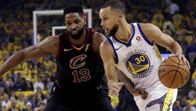 Golden State Warriors guard Stephen Curry drives against Cleveland Cavaliers center Tristan Thompson during the NBA Finals opener on Friday.(AP)