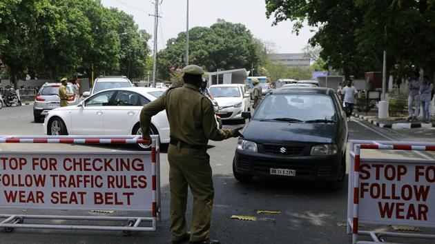 Security staff stopping outsiders’ and students’ cars without stickers from entering the campus at Gate No. 1 of Panjab University, Chandigarh, on Friday.(Anil Dayal/HT)