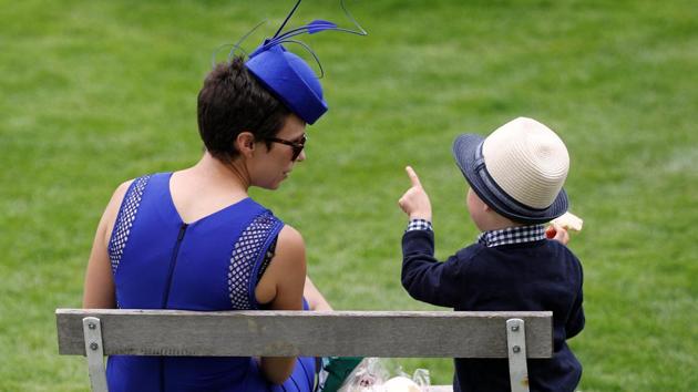 A little racegoer gets a crash course at the Epsom Derby. (Peter Nicholls / REUTERS) A little racegoer gets a crash course at the Epsom Derby. (Peter Nicholls / REUTERS)