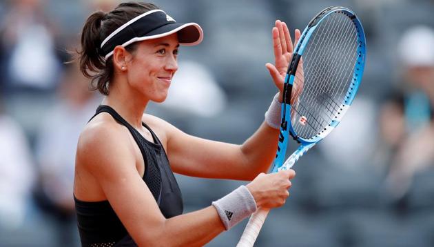 Garbine Muguruza celebrates after winning her French Open third round match against Samantha Stosur on Saturday.(REUTERS)