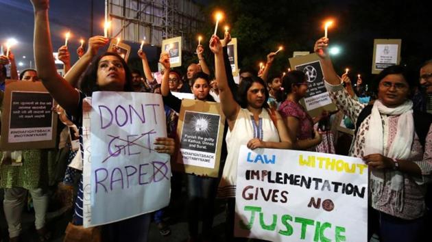 People hold candles and placards during a protest against rape in Surat, Gujarat. The police is yet to record the statement of the girl as she is in trauma.(Reuters File Photo)