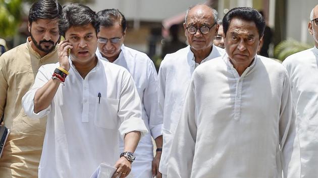 Congress Madhya Pradesh president Kamal Nath with senior Congress leaders Jyotiraditya Scindia and Digvijaya Singh come out after a meeting with the Election Commission at Nirvachan Sadan, in New Delhi.(PTI Photo)