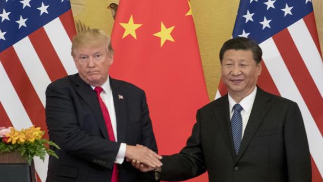 US President Donald Trump and Chinese President Xi Jinping shake hands during a joint statement to members of the media Great Hall of the People in Beijing, China. (AP File Photo) US President Donald Trump and Chinese President Xi Jinping shake hands during a joint statement to members of the media Great Hall of the People in Beijing, China. (AP File Photo)