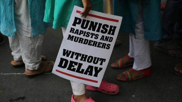 A protester stands with a placard during a protest against two recently reported rape cases as they gather near the parliament in New Delhi, India. (AP File Photo) A protester stands with a placard during a protest against two recently reported rape cases as they gather near the parliament in New Delhi, India. (AP File Photo)