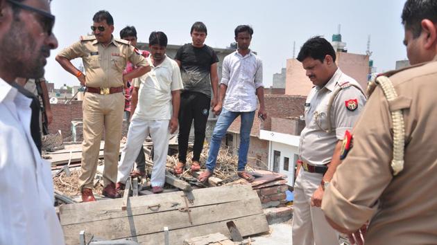 Police investigate at the spot where a body of a four-year-old boy was found inside a wooden chest on the rooftop of his neighbour's house - 18 months after he went missing on Sunday, in Ghaziabad, on Sunday. (Sakib Ali/HT Photo) Police investigate at the spot where a body of a four-year-old boy was found inside a wooden chest on the rooftop of his neighbour's house - 18 months after he went missing on Sunday, in Ghaziabad, on Sunday. (Sakib Ali/HT Photo)