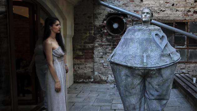 A woman looks at an artist of Romania's Masca Theatre waiting to perform. Bucharest is one of several Eastern European cities known as the “Paris of the East” because of its French-inspired architecture and gardens. (Vadim Ghirda / AP) A woman looks at an artist of Romania's Masca Theatre waiting to perform. Bucharest is one of several Eastern European cities known as the “Paris of the East” because of its French-inspired architecture and gardens. (Vadim Ghirda / AP)