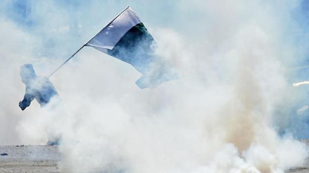 At least 12 people and four policemen were injured when an unidentified person hurled a grenade at security personnel in Jammu and Kashmir’s Shopian, police said on Monday amid a unilateral Ramzan ceasefire announced by the Centre last month. So far no militant organisation has claimed responsibility for the attack. (Tauseef Mustafa / AFP File) At least 12 people and four policemen were injured when an unidentified person hurled a grenade at security personnel in Jammu and Kashmir’s Shopian, police said on Monday amid a unilateral Ramzan ceasefire announced by the Centre last month. So far no militant organisation has claimed responsibility for the attack. (Tauseef Mustafa / AFP File)