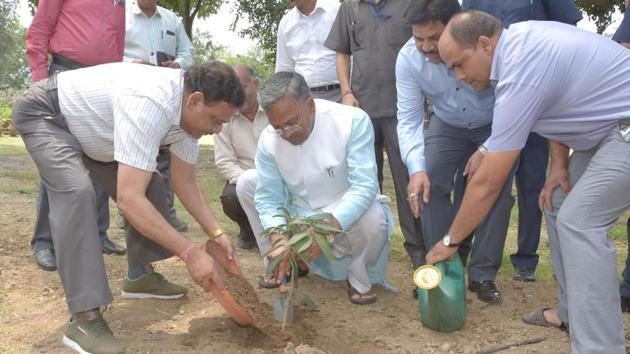 Uttarakhand chief minister Trivendra Singh Rawat plants a sapling on the occasion of World Environment Day on Tuesday.(HT Photo)