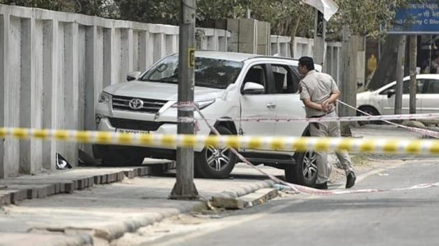 A policeman checks the stolen Fortuner SUV in which two men attempted to make a getaway after Delhi Police engaged them, at Jhilmil colony in Vivek Vihar, on Tuesday. (Sanchit Khanna/HT Photo) A policeman checks the stolen Fortuner SUV in which two men attempted to make a getaway after Delhi Police engaged them, at Jhilmil colony in Vivek Vihar, on Tuesday. (Sanchit Khanna/HT Photo)