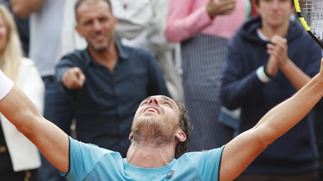 Italy's Marco Cecchinato cries as he celebrates winning his quarterfinal match of the French Open tennis tournament against Serbia's Novak Djokovic in four sets 6-3, 7-6 (7-4), 1-6, 7-6 (13-11). (AP) Italy's Marco Cecchinato cries as he celebrates winning his quarterfinal match of the French Open tennis tournament against Serbia's Novak Djokovic in four sets 6-3, 7-6 (7-4), 1-6, 7-6 (13-11). (AP)