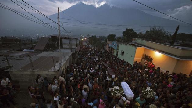 Elsewhere, the process of mourning had begun with residents of villages walking through the streets with caskets hoisted on their shoulders to the cemetery. President Jimmy Morales has declared three days of national mourning. (Santiago Billy / AP) Elsewhere, the process of mourning had begun with residents of villages walking through the streets with caskets hoisted on their shoulders to the cemetery. President Jimmy Morales has declared three days of national mourning. (Santiago Billy / AP)