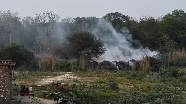 Smoke rises from a burning field near Kanpur’s industrial area. Lakhan said that he had never had it this bad before. His breathlessness and discomfort would earlier crop up in bad winters, when there was smog. But for the last two or three years, even the summers have been hard. (Chandan Khanna / AFP) Smoke rises from a burning field near Kanpur’s industrial area. Lakhan said that he had never had it this bad before. His breathlessness and discomfort would earlier crop up in bad winters, when there was smog. But for the last two or three years, even the summers have been hard. (Chandan Khanna / AFP)