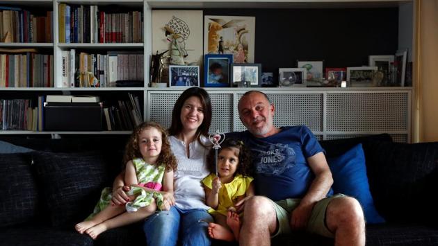 “Since plastic is dominating our daily life, it would be very difficult to stop using it. But, if someone somehow makes it like a habit, we think we could stop buying altogether,” said Alexandra Patrikiou, 39 (2nd Left) in the Greek capital Athens, who works hard to recycle paper and glass and buy recycled products. (Alkis Konstantinidis / REUTERS) 