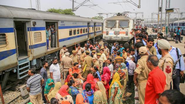 Police remove residents from the Railway colony from a demonstration on the tracks after they stopped a train while protesting over acute water shortage, at Jammu Railway Station. The demonstrators said that due the water shortage has thrown routine life out of gear. (PTI) Police remove residents from the Railway colony from a demonstration on the tracks after they stopped a train while protesting over acute water shortage, at Jammu Railway Station. The demonstrators said that due the water shortage has thrown routine life out of gear. (PTI)