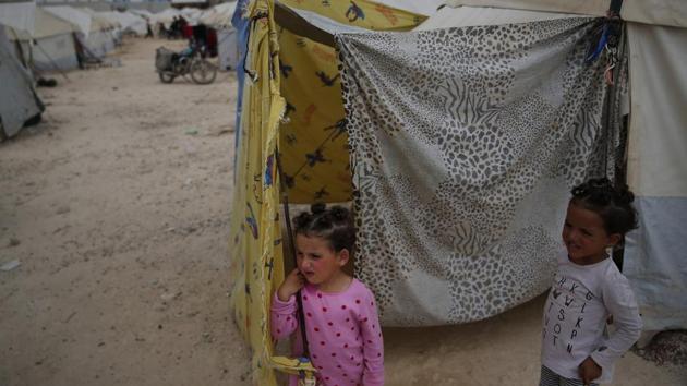 Members of the extended Sweidan family stand outside the family tent. A suspected chemical gas attack on April 7 killed more than 40 people in Douma. The town was the final target of the government’s campaign to seize control of eastern Ghouta’s suburbs from rebels after seven years of revolt. The Sweidans’ eldest son, 11-year-old Abdurrahman was among those affected. (Lefteris Pitarakis / AP) Members of the extended Sweidan family stand outside the family tent. A suspected chemical gas attack on April 7 killed more than 40 people in Douma. The town was the final target of the government’s campaign to seize control of eastern Ghouta’s suburbs from rebels after seven years of revolt. The Sweidans’ eldest son, 11-year-old Abdurrahman was among those affected. (Lefteris Pitarakis / AP)