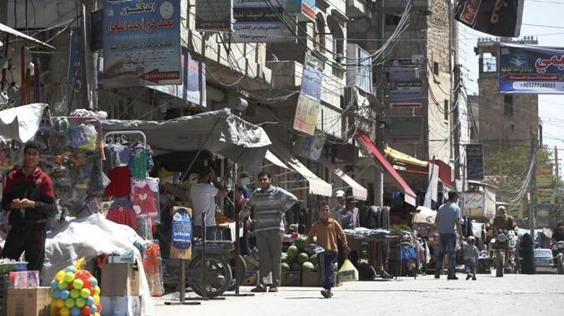 Al-Bab is one of a number of towns part of territory now controlled by Turkey after they chased away IS militants as well as Kurdish fighters. The last town captured earlier this year was Afrin after the Syrians seized it from the Kurdish fighters. Of a total of 66,000 displaced from Ghouta to northern Syria, about 20,000 are in al-Bab and other towns controlled by Turkey. (Lefteris Pitarakis / AP) Al-Bab is one of a number of towns part of territory now controlled by Turkey after they chased away IS militants as well as Kurdish fighters. The last town captured earlier this year was Afrin after the Syrians seized it from the Kurdish fighters. Of a total of 66,000 displaced from Ghouta to northern Syria, about 20,000 are in al-Bab and other towns controlled by Turkey. (Lefteris Pitarakis / AP)
