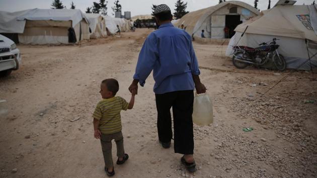 Western powers accuse the Syrian government of using chemical gas in Douma, and the US, France and Britain have bombed government sites in retaliation. Syria and Russia deny chemical weapons were used. Inspectors from the Organization for the Prohibition of Chemical Weapons collected samples from Douma to establish whether a chemical weapon was used. It hasn’t issued a report yet. (Lefteris Pitarakis / AP) Western powers accuse the Syrian government of using chemical gas in Douma, and the US, France and Britain have bombed government sites in retaliation. Syria and Russia deny chemical weapons were used. Inspectors from the Organization for the Prohibition of Chemical Weapons collected samples from Douma to establish whether a chemical weapon was used. It hasn’t issued a report yet. (Lefteris Pitarakis / AP)