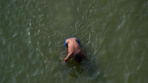 A boy swims in the river Ganga in Kanpur. Misra believes Kanpur’s water pollution is worse than the air because of its huge leather industry and tanneries. The WHO report was based on 2016 Indian data that showed Kanpur’s average PM2.5 concentration at 173 micrograms per cubic metre -- about seven times the normal safe level. (Chandan Khanna / AFP) A boy swims in the river Ganga in Kanpur. Misra believes Kanpur’s water pollution is worse than the air because of its huge leather industry and tanneries. The WHO report was based on 2016 Indian data that showed Kanpur’s average PM2.5 concentration at 173 micrograms per cubic metre -- about seven times the normal safe level. (Chandan Khanna / AFP)