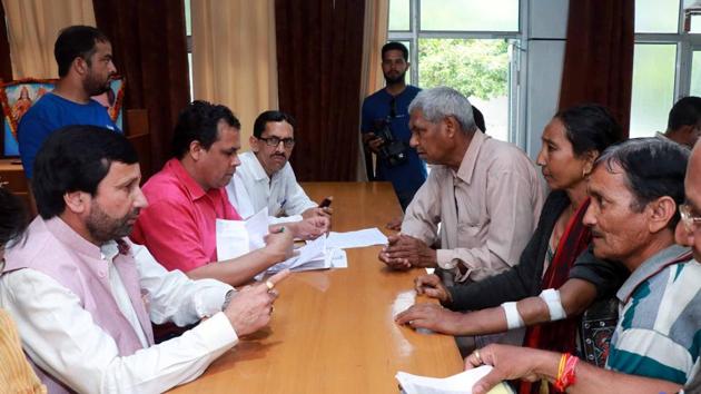 Finance minister Prakash Pant listens to problems during a public meeting at BJP office in Dehradun on Wednesday. (HT Photo) Finance minister Prakash Pant listens to problems during a public meeting at BJP office in Dehradun on Wednesday. (HT Photo)