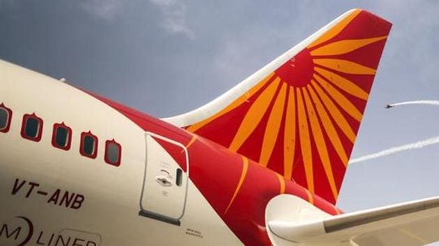 Planes fly past a Boeing Co. 787 Dreamliner aircraft, operated by Air India Ltd.,(Photographer: Dhiraj SIngh/Bloom)