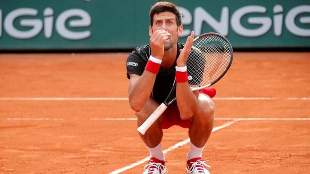 Novak Djokovic appeared distraught after his French Open quarter-final defeat by unseeded Marco Cecchinato. (REUTERS) Novak Djokovic appeared distraught after his French Open quarter-final defeat by unseeded Marco Cecchinato. (REUTERS)