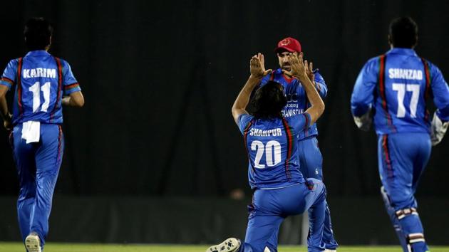 Afghanistan's Shapoor Zadran, center, celebrates after taking the first wicket of Bangladesh during the second T20 cricket match between Afghanistan and Bangladesh.(AP) Afghanistan's Shapoor Zadran, center, celebrates after taking the first wicket of Bangladesh during the second T20 cricket match between Afghanistan and Bangladesh.(AP)