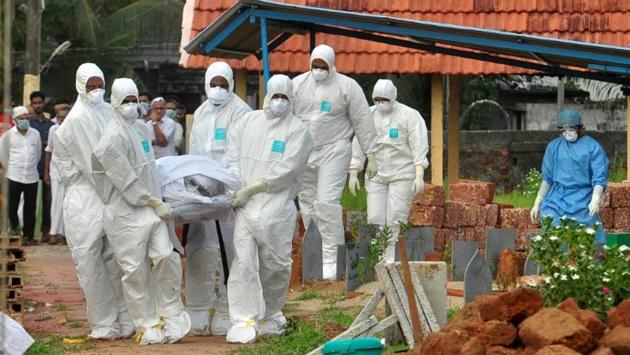 Dr RS Gopakumar, the health officer of Kozhikode Corporation went beyond his call of duty by taking the responsibility of handling the final rites of 12 people who died of the Nipah virus. The close relatives stayed away due to fear of contracting the deadly virus. So far, 17 people have died of Nipah virus -- 14 in Kozhikode and three in neighbouring Malappuram since its outbreak last month. (REUTERS File) Dr RS Gopakumar, the health officer of Kozhikode Corporation went beyond his call of duty by taking the responsibility of handling the final rites of 12 people who died of the Nipah virus. The close relatives stayed away due to fear of contracting the deadly virus. So far, 17 people have died of Nipah virus -- 14 in Kozhikode and three in neighbouring Malappuram since its outbreak last month. (REUTERS File)