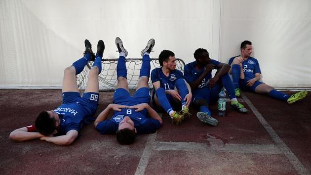 The players rest during the half-time break. In Russia, migrant workers often carry out poorly paid menial work, and according to human rights groups are subjected to frequent document checks by police and suffer racist discrimination. Russian authorities deny mistreatment and say that document checks are required for national security. (Anton Vaganov / REUTERS) The players rest during the half-time break. In Russia, migrant workers often carry out poorly paid menial work, and according to human rights groups are subjected to frequent document checks by police and suffer racist discrimination. Russian authorities deny mistreatment and say that document checks are required for national security. (Anton Vaganov / REUTERS)