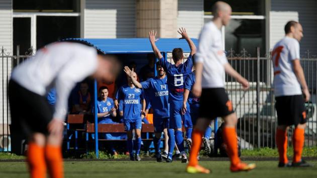 Players from FC Maxima celebrate a goal. Maxima has taken part in St Petersburg’s city championships, a competition for amateur soccer players, finishing fourth in 2017. (Anton Vaganov / REUTERS) Players from FC Maxima celebrate a goal. Maxima has taken part in St Petersburg’s city championships, a competition for amateur soccer players, finishing fourth in 2017. (Anton Vaganov / REUTERS)