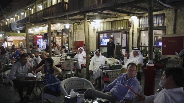 An evening scene at the Waqif Souq in Doha. Daily life has mostly remain unchanged apart from a signs of the boycott here and there — grocery stores once filled with dairy products from Saudi Arabia, which has shut down Qatar’s only land border, now stock items from Turkey and Iran. Air routes with the flagship Qatar Airways now route through Oman or over Iranian airspace. (Kamran Jebreili / AP)
