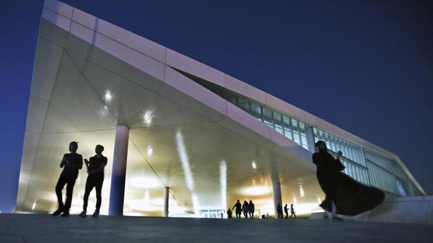 People leave the Qatar National Library building designed by Dutch architecture firm OMA in Doha. Qatar strongly denies supporting terrorism, but backs the Muslim Brotherhood and other Islamist groups outlawed as terrorists by the boycotting nations. It has also long maintained warm ties with Saudi Arabia’s archrival Iran, with which it shares a large underwater gas field. (Kamran Jebreili / AP)