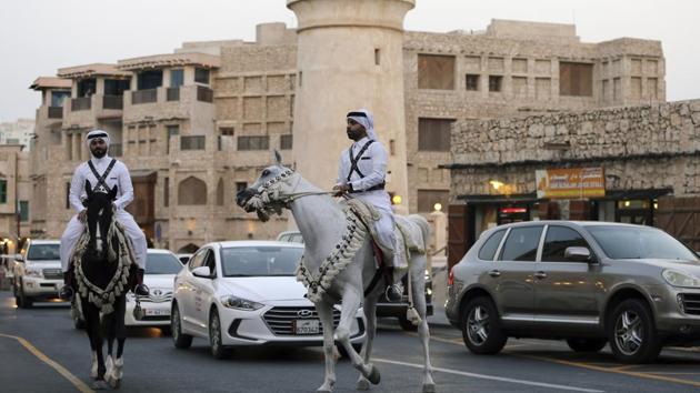 Qatari police officers in national dress, wearing crisscrossing bandoliers, patrol on horseback, a nod to a time before Qatar’s vast natural gas wealth when rifle-carrying cavalry defended the emirate. Today, Qatar has a modern military and hosts some 10,000 American forces at the vast al-Udeid Air Base. So far though, this dispute has only been one of words. (Kamran Jebreili / AP)