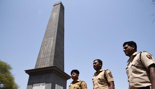 Police officials keeps a watch around the vijay stambha (victory memorial) in Bhima Koregaon in Pune on May 8, 2018. Violence had erupted when Dalit groups were celebrating the bicentenary of the Bhima Koregaon battle in which the forces of the British East India Company defeated the Peshwa’s army.(HT FILE PHOTO)