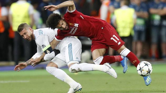 Sergio Ramos isn't taking blame for the challenge that ended up hurting Egypt star Mohamed Salah in the Champions League final. Salah left the field in tears after injuring his left shoulder in a tussle with Ramos with the score 0-0 in the first half. (AP) Sergio Ramos isn't taking blame for the challenge that ended up hurting Egypt star Mohamed Salah in the Champions League final. Salah left the field in tears after injuring his left shoulder in a tussle with Ramos with the score 0-0 in the first half. (AP)