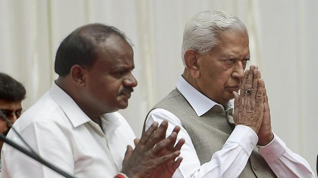 Karnataka governor Vajubhai Vala and chief minister HD Kumaraswamy during the swearing-in ceremony of newly inducted ministers during the first expansion of the JD(S) and Congress coalition government, at Rajbhavan in Bengaluru on Wednesday.(PTI Photo) Karnataka governor Vajubhai Vala and chief minister HD Kumaraswamy during the swearing-in ceremony of newly inducted ministers during the first expansion of the JD(S) and Congress coalition government, at Rajbhavan in Bengaluru on Wednesday.(PTI Photo)