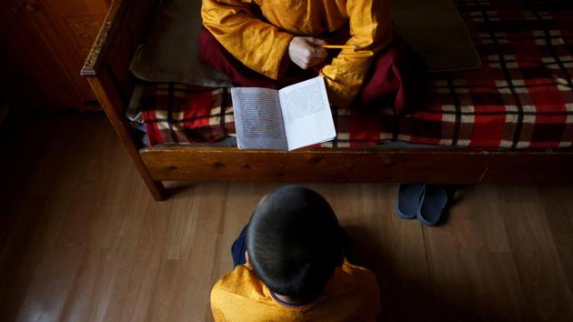 Lobsang Tayang wakes his students, 10-year-old Batkhan Tuul and 11-year-old Temuulen, at around seven to test their memory of the scriptures and chanting which fills the rest of the morning. In the afternoon, the younger monks can study topics such as mathematics and literature - if a teacher can be found. (Thomas Peter / REUTERS) Lobsang Tayang wakes his students, 10-year-old Batkhan Tuul and 11-year-old Temuulen, at around seven to test their memory of the scriptures and chanting which fills the rest of the morning. In the afternoon, the younger monks can study topics such as mathematics and literature - if a teacher can be found. (Thomas Peter / REUTERS)