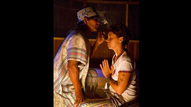 In a straw hut, engulfed by the nighttime cacophony of the Amazon rainforest, Flores inhales a potent tobacco from a pipe and blows smoke on Pamela Moronci’s head to cleanse her. The 30-year-old businesswoman said she first tried ayahuasca in Italy, as she fought depression, and credits it with “finding truths” about herself that regular meditation could not provide. (Martin Mejia / AP)