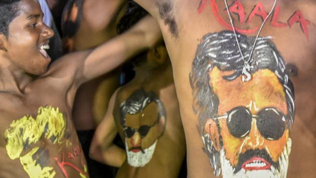 Fans of Bollywood star Rajinikanth with his portraits bodypainted dance on the release of his new film Kaala in Mumbai. The movie so far has received an underwhelming response on its opening day. Some opine that the Cauvery controversy, Ramzan, clash with Jurassic World coupled with Rajinikanth’s politics could have played a part. (Kunal Patil / HT Photo)