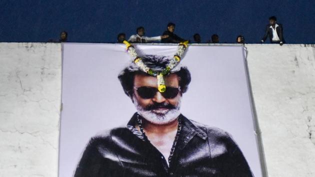 Fans adorn the hoarding of actor Rajinikanth with a garland in front of a movie theatre on the first day of the actor’s new film Kaala at Carnival Cinemas IMAX Wadala in Mumbai, Maharashtra, on June 7, 2018. (Kunal Patil / HT Photo) Fans adorn the hoarding of actor Rajinikanth with a garland in front of a movie theatre on the first day of the actor’s new film Kaala at Carnival Cinemas IMAX Wadala in Mumbai, Maharashtra, on June 7, 2018. (Kunal Patil / HT Photo)