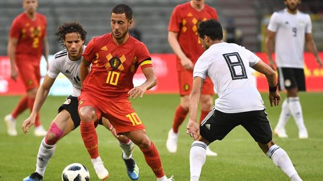 Belgium's forward Eden Hazard (C) vies for the ball with Egypt's midfielder Tarek Hamed (R) during the international friendly football match between Belgium and Egypt at the King Baudouin Stadium, in Brussels, on June 6, 2018. (AFP) Belgium's forward Eden Hazard (C) vies for the ball with Egypt's midfielder Tarek Hamed (R) during the international friendly football match between Belgium and Egypt at the King Baudouin Stadium, in Brussels, on June 6, 2018. (AFP)