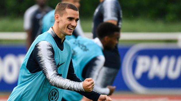 French forward Antoine Griezmann reacts as he takes part in a training session. (AFP) French forward Antoine Griezmann reacts as he takes part in a training session. (AFP)